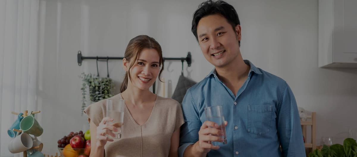Woman enjoying clean drinking water